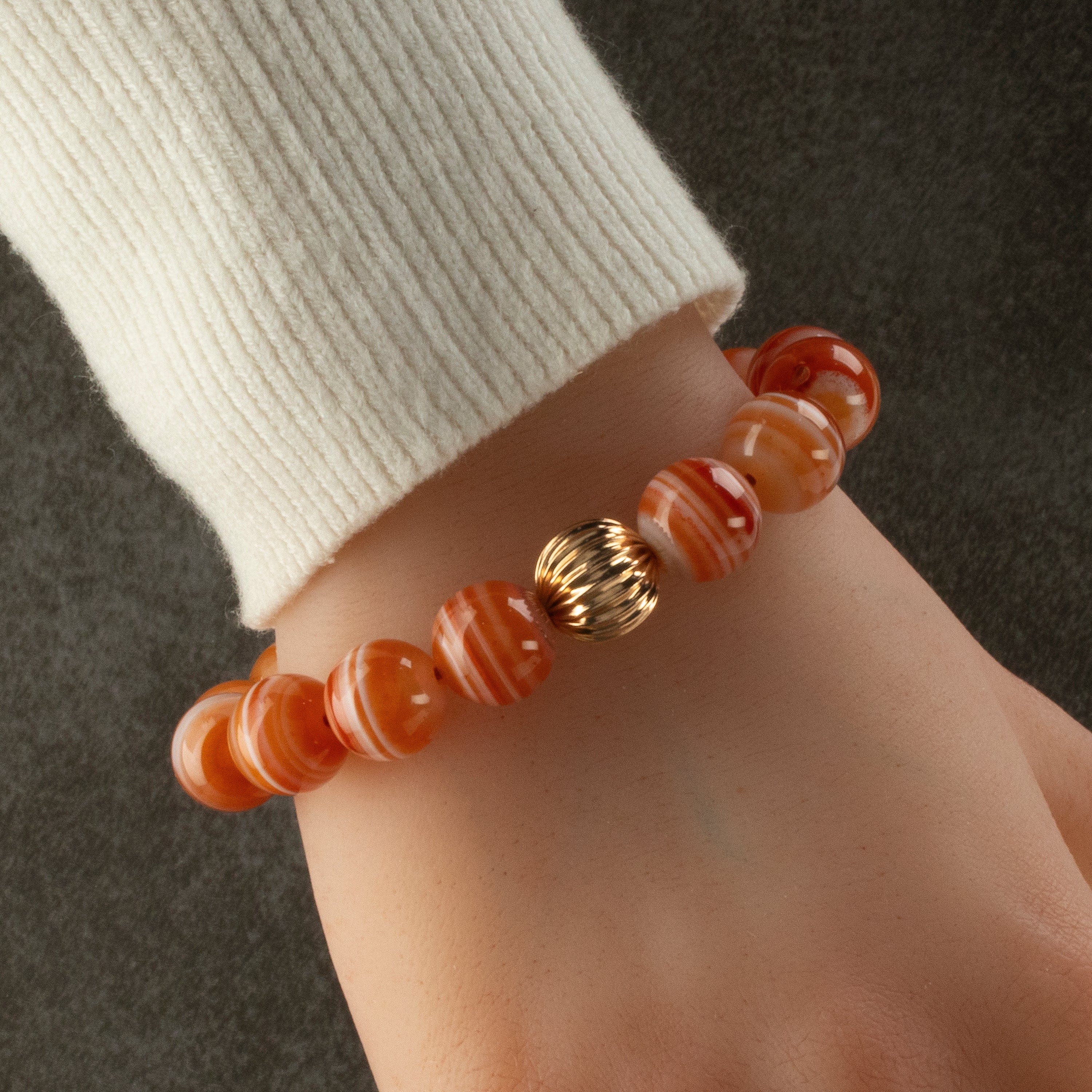 Kalifano Gemstone Bracelets Polished Banded Carnelian 12mm Gemstone Bead Elastic Bracelet with Gold Accent Bead GOLD-BGP-069