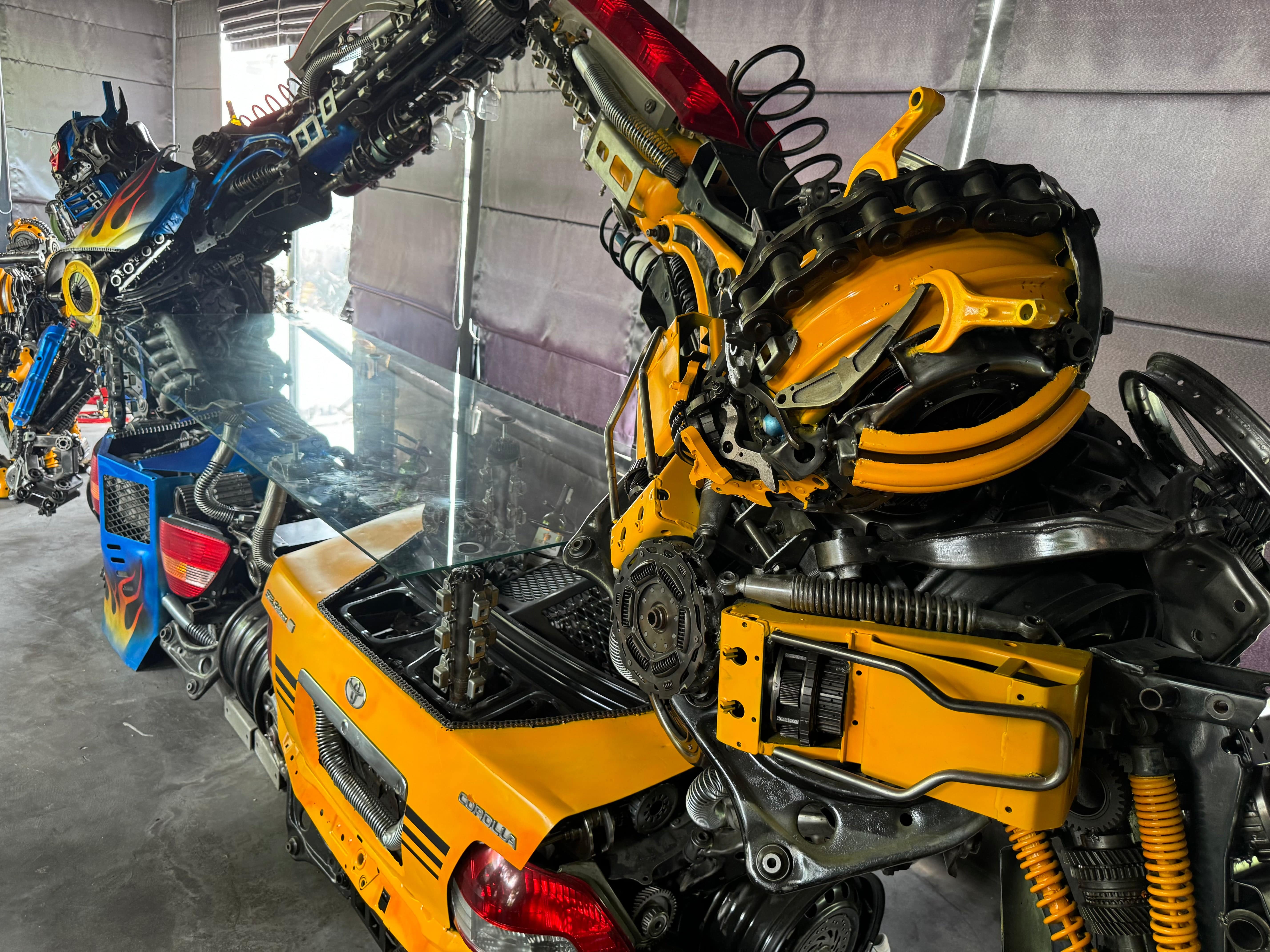 Kalifano Recycled Metal Art Bumblebee & Optimus Prime Inspired Bar Table Recycled Metal Art Sculpture RMS-BAROPBB-S