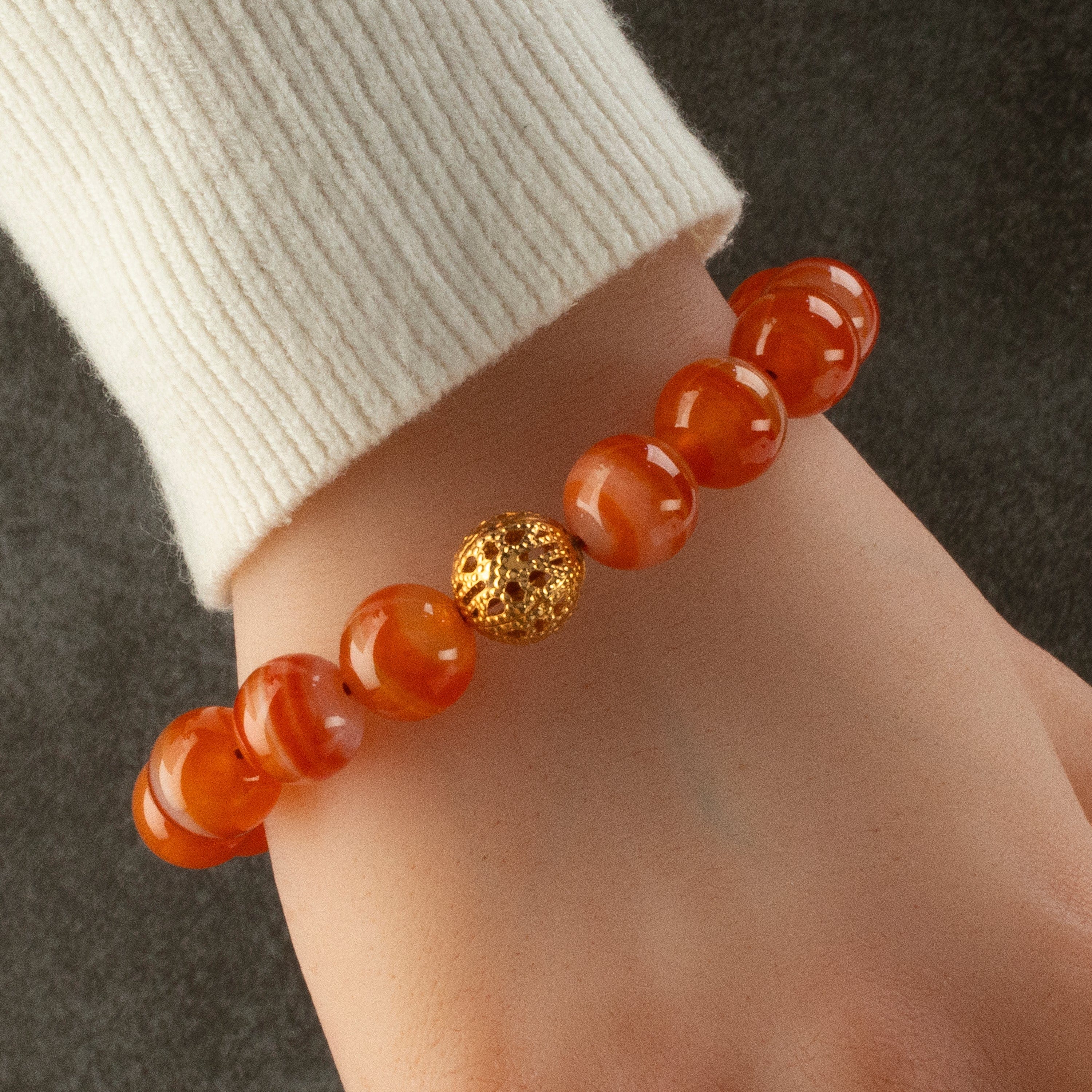 Kalifano Gemstone Bracelets Polished Banded Carnelian 12mm Gemstone Bead Elastic Bracelet with Gold Accent Bead GOLD-BGP-071