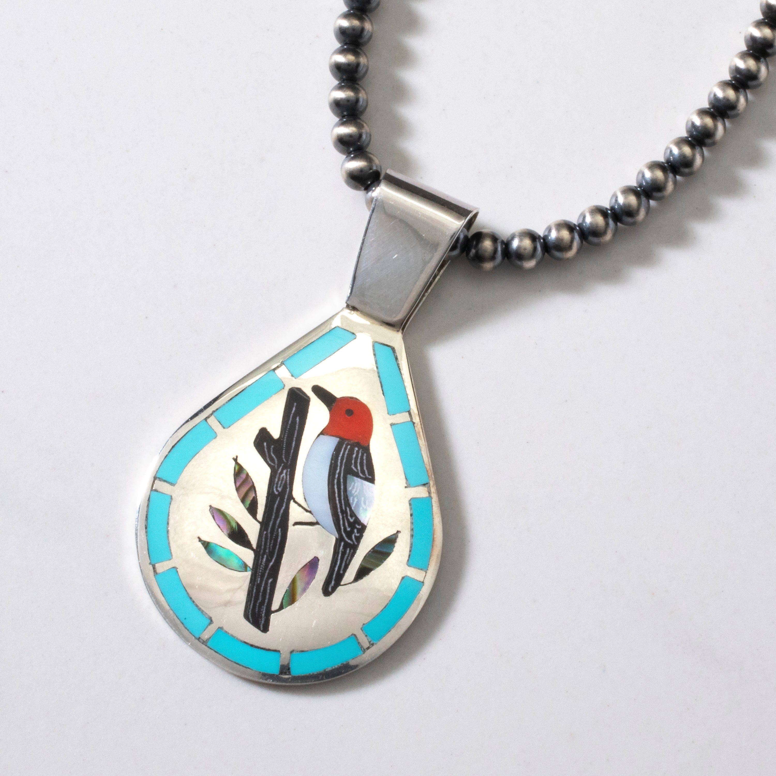 Kalifano Native American Jewelry 18" Dennis & Nancy Edaakie Mutli Gem Woodpecker Zuni Inlay Pendant with 4mm Navajo Pearl Necklace USA Native American Made 925 Sterling Silver NAN1500.010